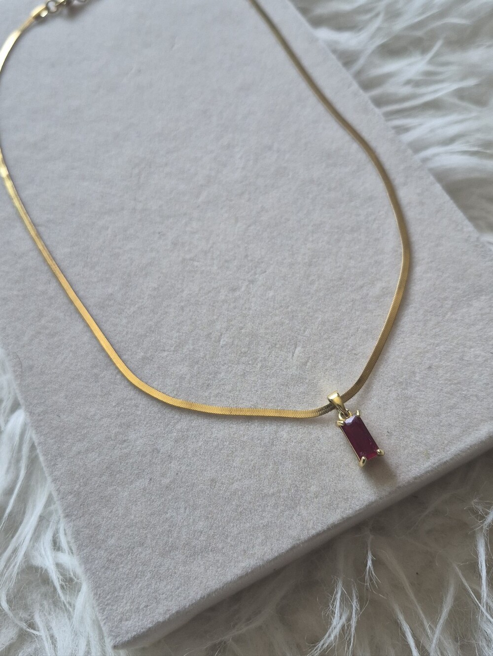 Gold Tone Herringbone Necklace with Ruby Red Rectangular Pendant